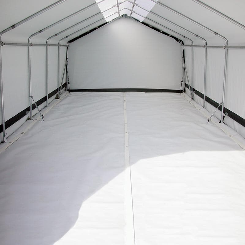 White floor plastic laid inside a tunnel frame