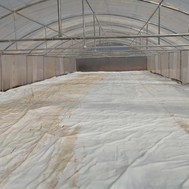 Floor plastic covering the ground along the full length of a tunnel