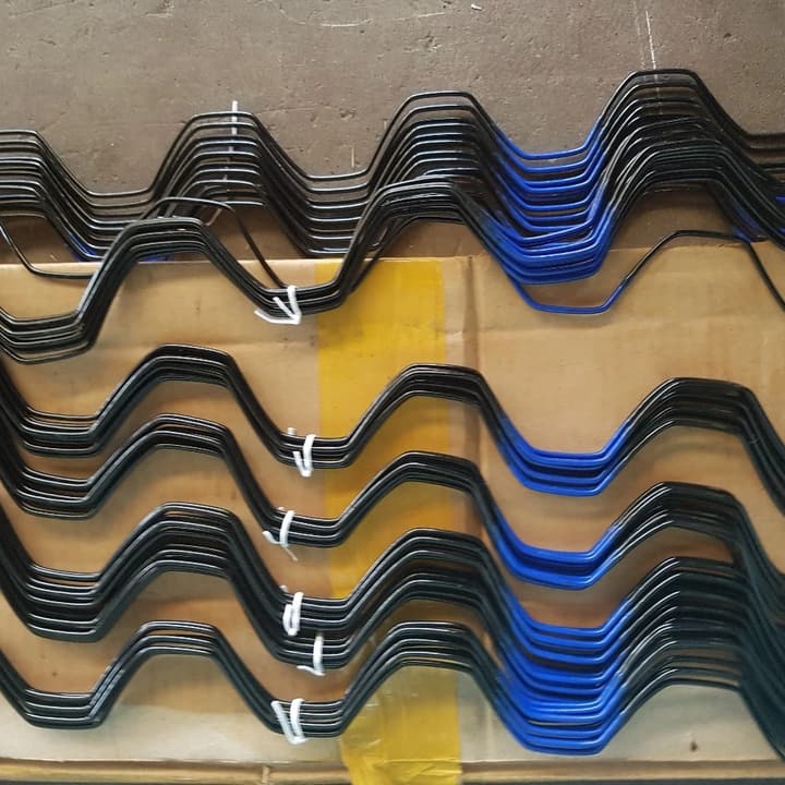 Bundles of black and blue wiggle wire for fixing tunnel plastic